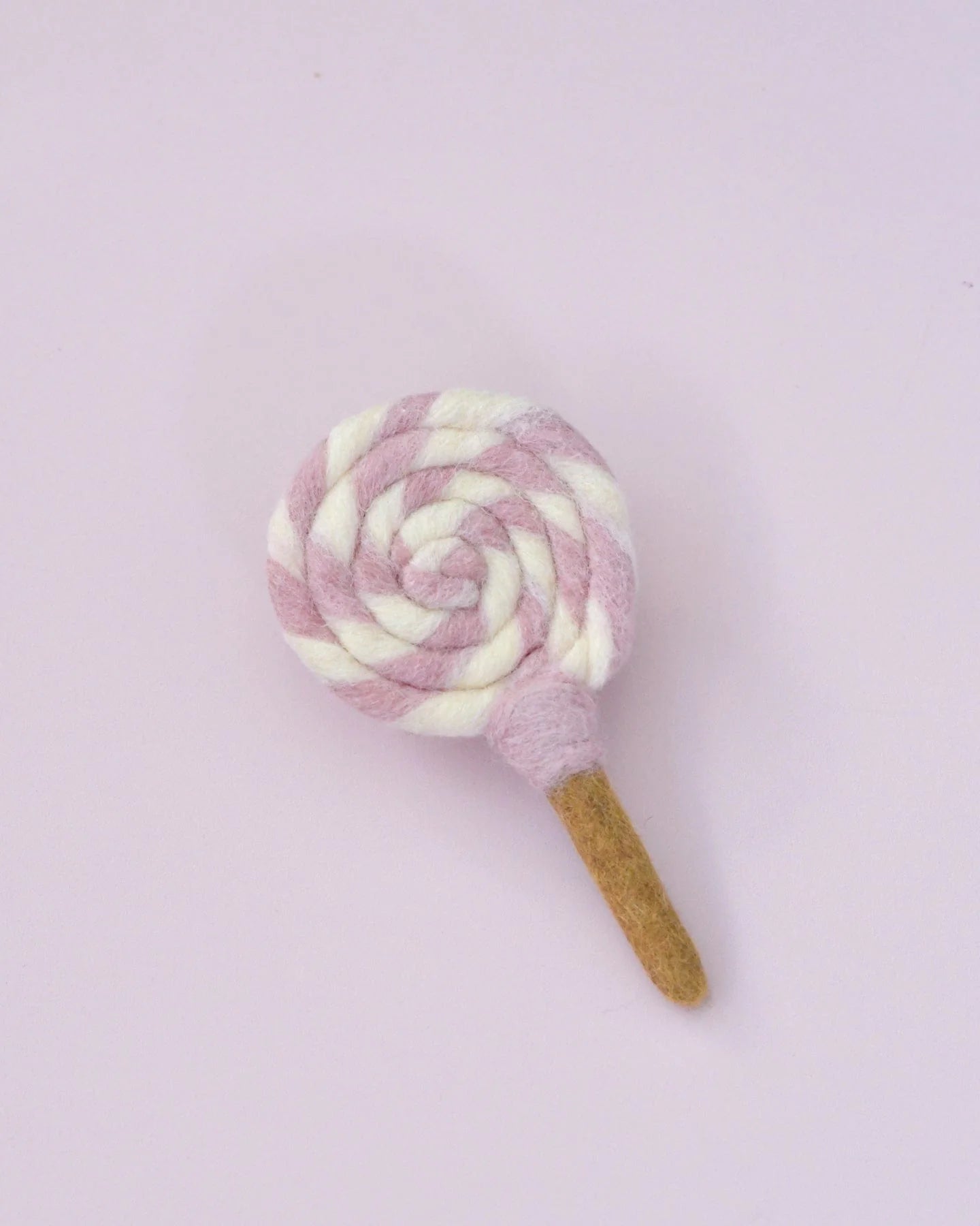 Sucette tourbillonnante en feutre rose et blanc